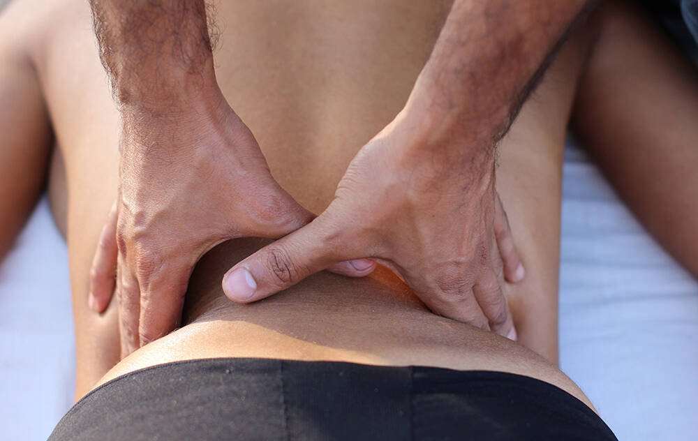 Therapeutic massage stroke on the back